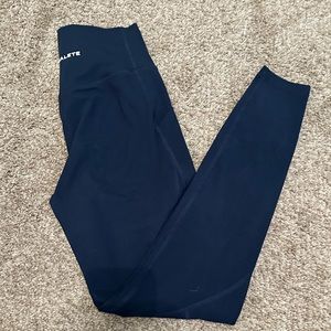 Navy blue Alphalete leggings. With side pockets